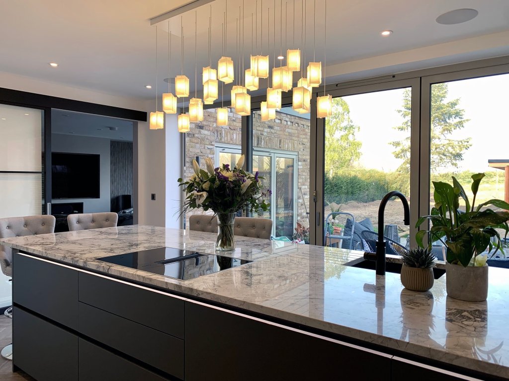 Kitchen lights above an island countertop.