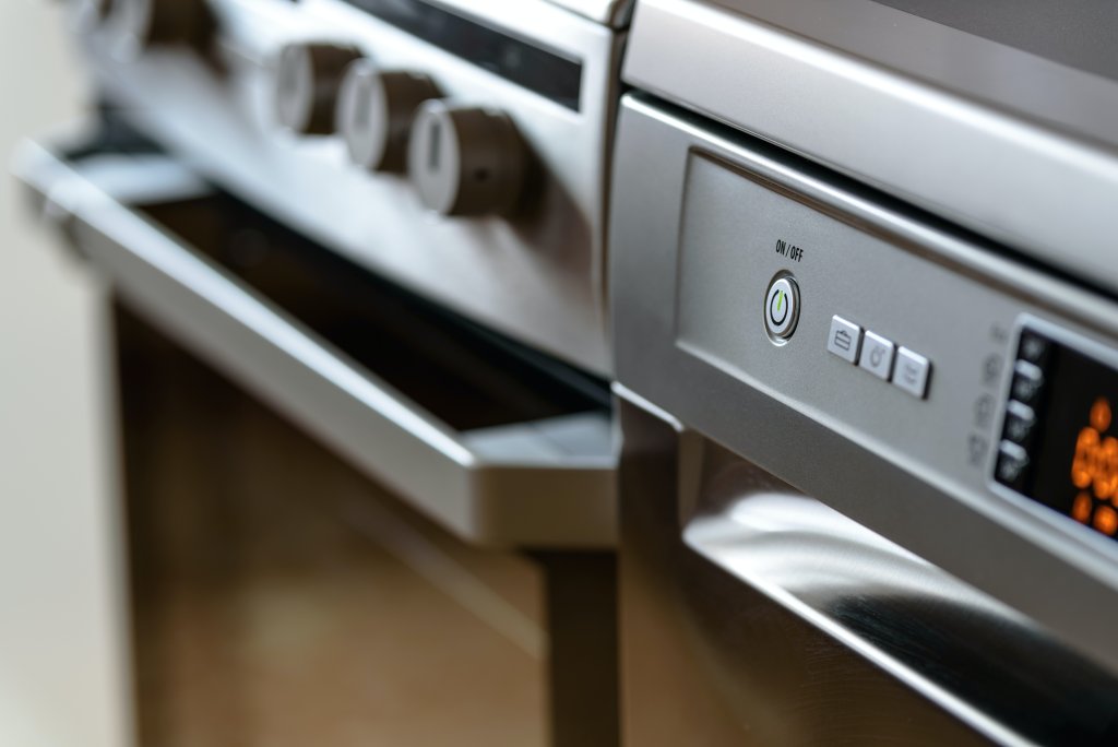 Closeup of a dishwasher and oven kitchen appliance. Photo by <a href="https://www.pexels.com/photo/close-up-photo-of-dishwasher-213162/>PhotoMIX </a>.